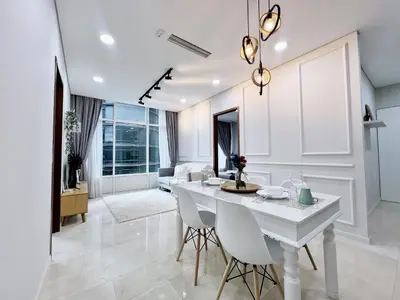 a living room with a white table and chairs at Sky Suites Airy 2BR Suite at KLCC in Kuala Lumpur