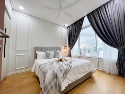 a bedroom with a large bed and a large window at Sky Suites Central 2BR Suite KLCC View in Kuala Lumpur