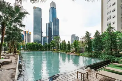 a pool in the middle of a city with buildings at Modern Art 2BR Agile Bukit Bintang by RumaBnB in Kuala Lumpur