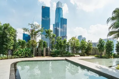 a swimming pool with a city skyline in the background at Modern Art 2BR Agile Bukit Bintang by RumaBnB in Kuala Lumpur