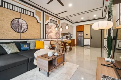 a living room with a couch and a table at Modern Art 2BR Agile Bukit Bintang by RumaBnB in Kuala Lumpur