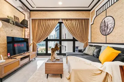 a living room with a couch and a tv at Modern Art 2BR Agile Bukit Bintang by RumaBnB in Kuala Lumpur