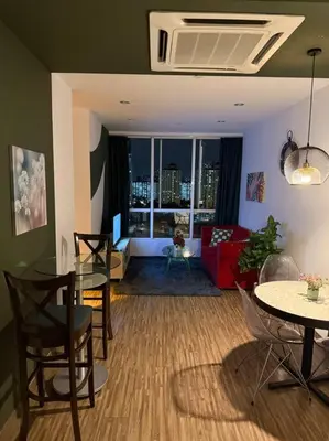 a living room with a table and chairs and a couch at #breathtaking#zetaparkmall#klcc#Honeymoon#2p#118 in Kuala Lumpur