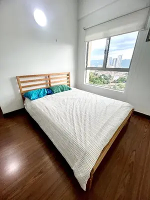 a bedroom with a large bed with a large window at Superior Seri Maya Kuala Lumpur in Kuala Lumpur