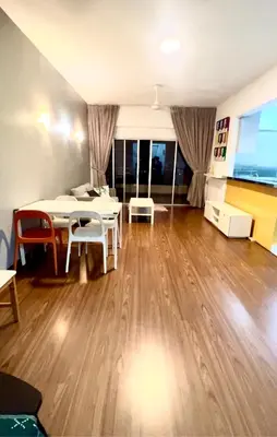 a living room with a table and chairs and a couch at Superior Seri Maya Kuala Lumpur in Kuala Lumpur