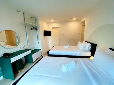 a hotel room with two beds and a mirror at Times Square by Manhattan Group in Kuala Lumpur