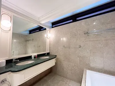 a bathroom with two sinks and a large mirror at Times Square by Manhattan Group in Kuala Lumpur