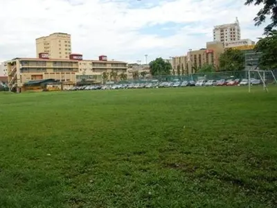 a field with a soccer ball in a city at YMCA Kuala Lumpur in Kuala Lumpur