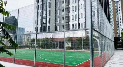 a tennis court in front of a building at Sentral Suites By Eassy Hotel in Kuala Lumpur