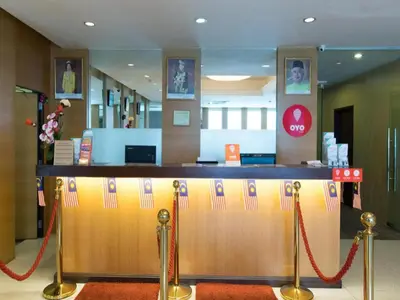 a bar with a red rope around it in a store at OYO 139 The Marque Hotel in Kuala Lumpur