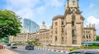a large building with a clock tower on top of it at OYO 90173 Hotel Mekong in Kuala Lumpur
