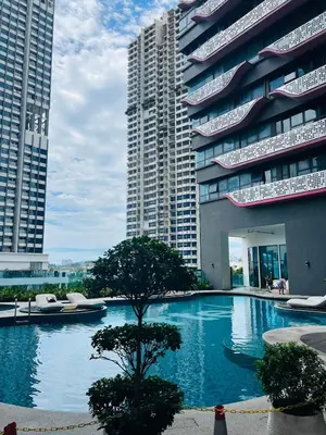 a large swimming pool in front of two tall buildings at Arte Plus by Willow Trip in Ampang