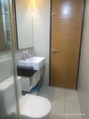 a bathroom with a sink and a toilet and a mirror at 018-6 Sweet Home-Casa Residency 2R 2B in Kuala Lumpur
