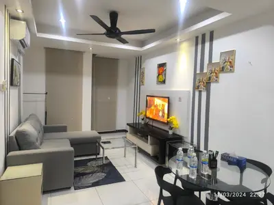 a living room with a couch and a tv at 018-6 Sweet Home-Casa Residency 2R 2B in Kuala Lumpur
