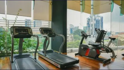a gym with three exercise bikes and a window at 018-6 Sweet Home-Casa Residency 2R 2B in Kuala Lumpur