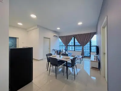 a dining room and living room with a table and chairs at Arte Plus by Manhattan Group in Kuala Lumpur