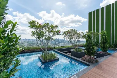 a swimming pool with trees on top of a building at The Riv at Riveria City KL Sentral KLCC view16 in Kuala Lumpur