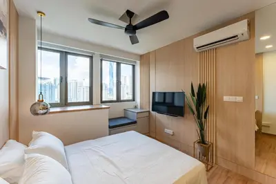 a bedroom with a bed and a flat screen tv at The Riv at Riveria City KL Sentral KLCC view16 in Kuala Lumpur
