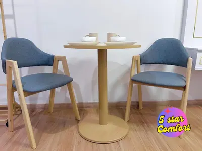 two chairs and a table and a table and chairs at 5 Star Comfort Riveria City KL Sentral 4 pax infinity pool in Kuala Lumpur