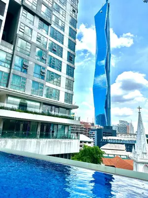 a swimming pool in front of a tall building at Home Sweet Home at Robertson Bukit Bintang,TRX,KLCC in Kuala Lumpur