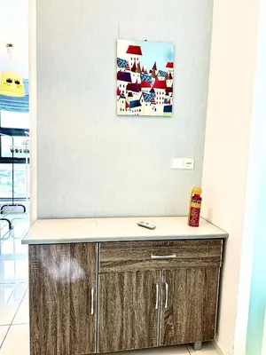 a kitchen with a counter and a picture on the wall at Home Sweet Home at Robertson Bukit Bintang,TRX,KLCC in Kuala Lumpur