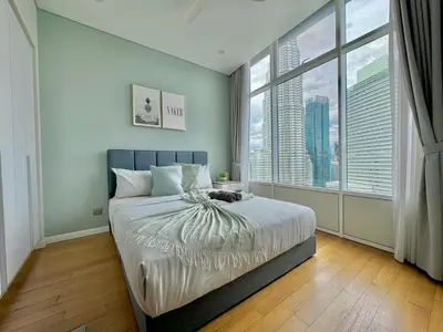 a bedroom with a large bed and a large window at Sky Suites Wonder 2BR Suite KLCC View in Kuala Lumpur