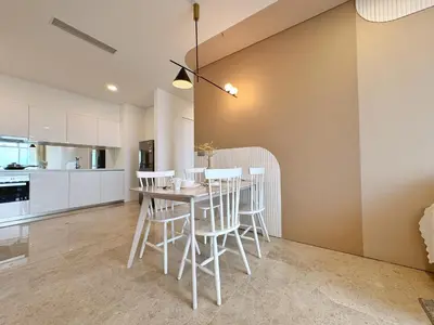 a kitchen and dining room with a table and chairs at Sky Suites Upper 3BR Suite at KLCC in Kuala Lumpur