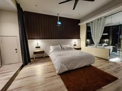 a bedroom with a large white bed and a large window at Désir Amorous KL #Jacuzzi #NFLX #Prjscn120