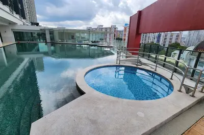 a swimming pool on the roof of a building at Désir Amorous KL #Jacuzzi #NFLX #Prjscn120