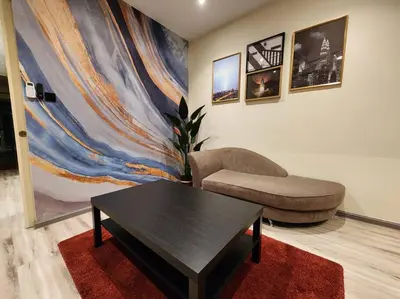 a living room with a coffee table and a couch at Désir Amorous KL #Jacuzzi #NFLX #Prjscn120