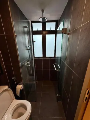 a bathroom with a toilet and a window at Klcc view residences in Kuala Lumpur