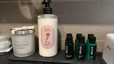 a group of four bottles of hair products on a shelf at City Centre Apartment in Kuala Lumpur