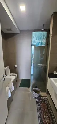 a bathroom with a shower and a toilet and a sink at City Centre Apartment in Kuala Lumpur