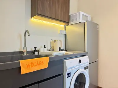 a kitchen with a washing machine and a sink at X - The Thomas Bangsar South Midvalley LRT Kerinchi in Kuala Lumpur