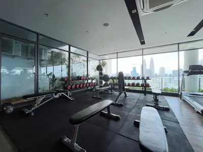 a gym with a view of a city at The colony by infinitum sweet home in Kuala Lumpur