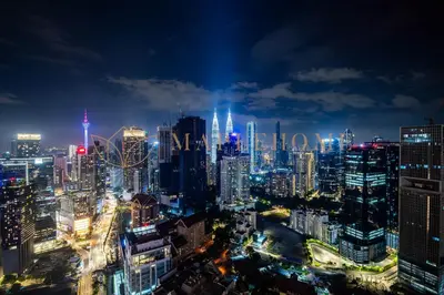 a view of a city at night at Agile Premier Suites Kuala Lumpur in Kuala Lumpur