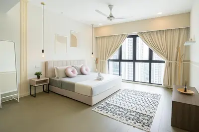 a bedroom with a bed and a large window at Elegant 1BR in OOAK Suites, Mont Kiara KL - Walk to Malls & Dining in Kuala Lumpur