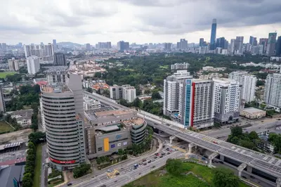 an overhead view of a city with a highway and buildings at Neu Suites By Cozy Unit L30RA 2-3PAX near KLCC & Jelatek LRT in Kuala Lumpur