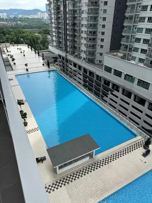 an overhead view of a large swimming pool on a building at Razak City Residences in Kuala Lumpur