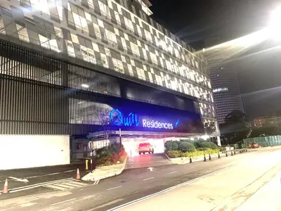 a building with a sign on the side of it at Quill Residences Service Suites By BR in Kuala Lumpur