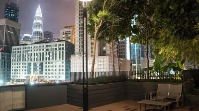 a view of a city skyline at night at Spacious Family Apt 3-Min Walk to KLCC MRT RO Water Baby Crib Home Cinema Projector in Kuala Lumpur