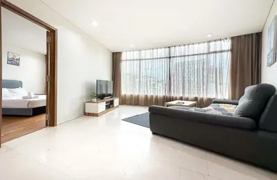 a living room with a couch and a bed at Vortex KLCC Vibes in Kuala Lumpur