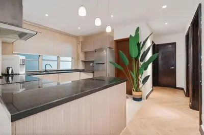 a kitchen with a large counter top in a room at Retreat In The Heart of KLCC, The Corinthians in Kuala Lumpur