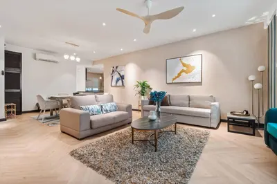 a living room with two couches and a table at Retreat In The Heart of KLCC, The Corinthians in Kuala Lumpur