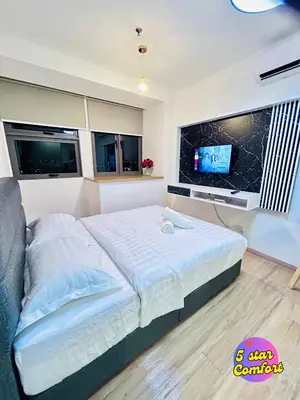 a bedroom with a large bed and a tv at 5 Star Comfort Riveria City KL Sentral 2pax Infinity pool in Kuala Lumpur