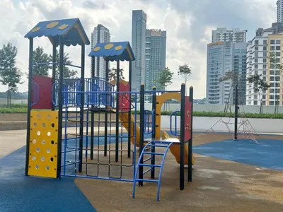 a playground in a park with a slide at 3 bedroom apt L26 at kl sentral with city view in Kuala Lumpur