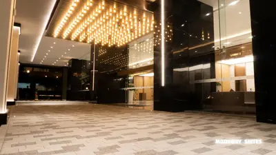 an empty lobby of a building with lights at Harmony Luxury Suites At TM Persiaran Stonor KLCC in Kuala Lumpur
