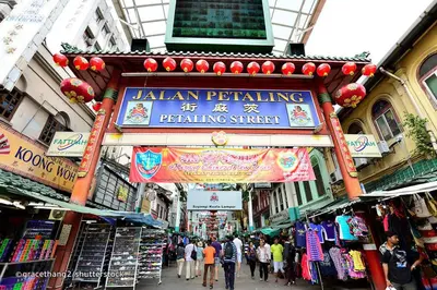 a sign for a jalan penketuing shop in a street at Modern 2BR Fairlane Retreat Steps from Lot 10 in Kuala Lumpur