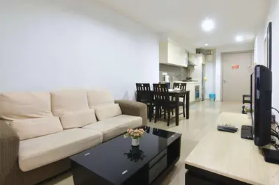 a living room with a couch and a table at Modern 2BR Fairlane Retreat Steps from Lot 10 in Kuala Lumpur
