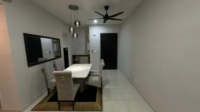 a dining room with a table and a ceiling fan at Datum Jelatek Superb Suite KL By LH in Kuala Lumpur